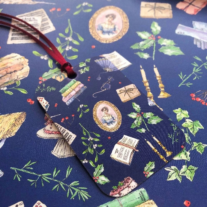 Designed by hand, this rich navy gift wrap is sprinkled with meticulously illustrated items to put you in the festive spirit, as well as some subtly and not-so-subtly hints to your favourite author: mistletoe, playing cards, a Christmas robin, a stack of books, Jane Austen's famous portrait, and even more.