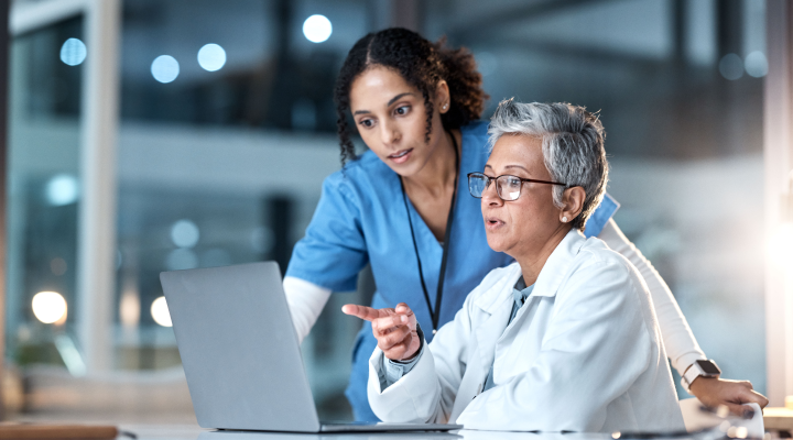 Dentist and Hygienist discussing about transitioning to the cloud