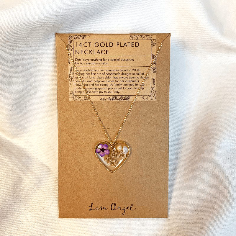 The Heart pendent necklace is shown on its jewellery display card. The card states "14ct gold plated necklace", making it a beautful pride and prejudice gift 