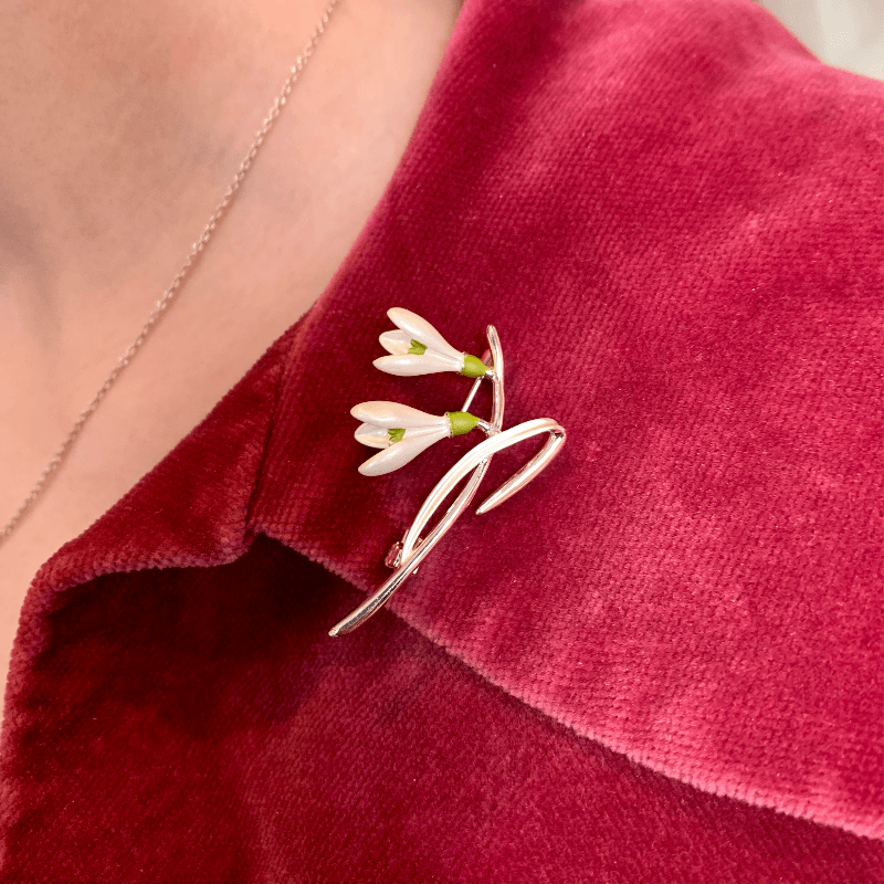 snowdrop brooch worn on a red regency spencer jacket 